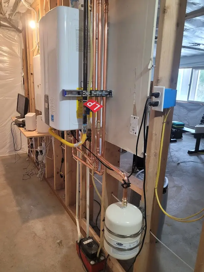 Licensed plumber repairing a kitchen sink in Coal